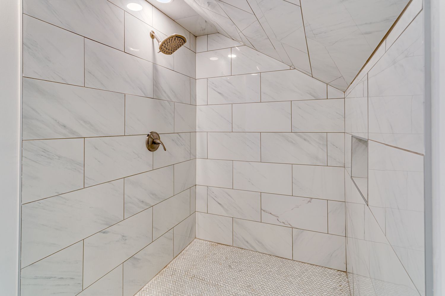 Walk-in shower with white subway tile
