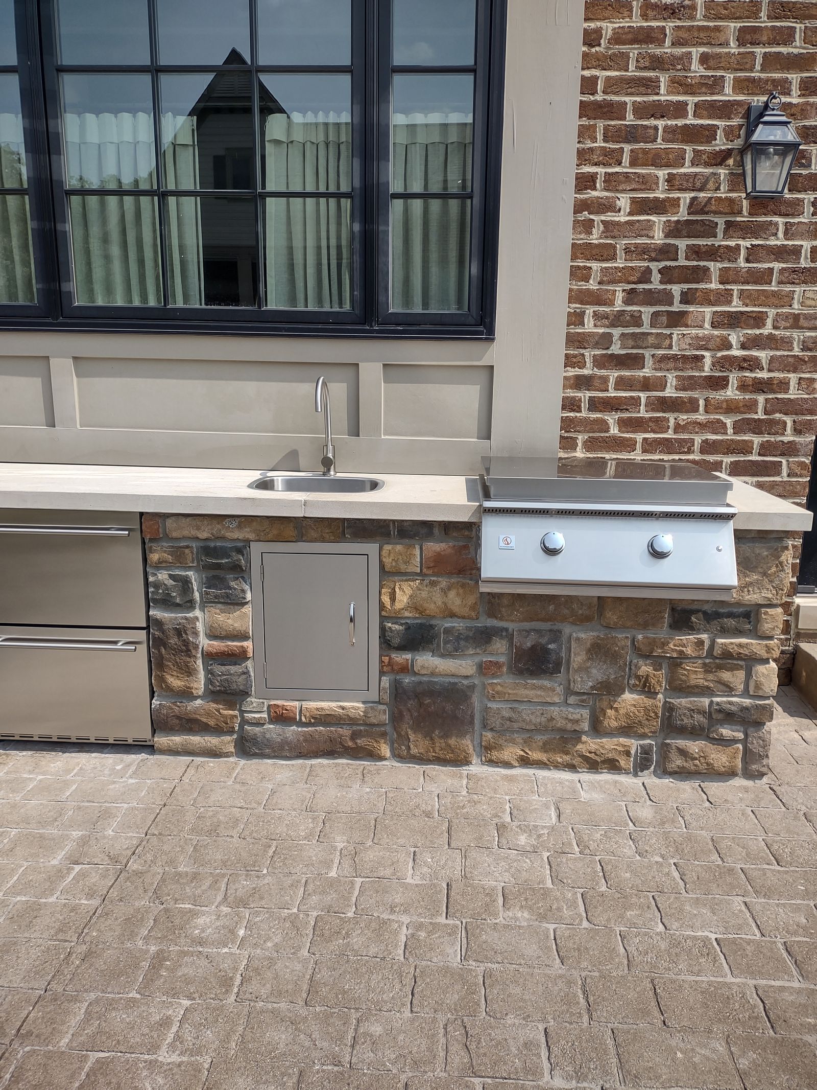 Stone bar and grill station with seating