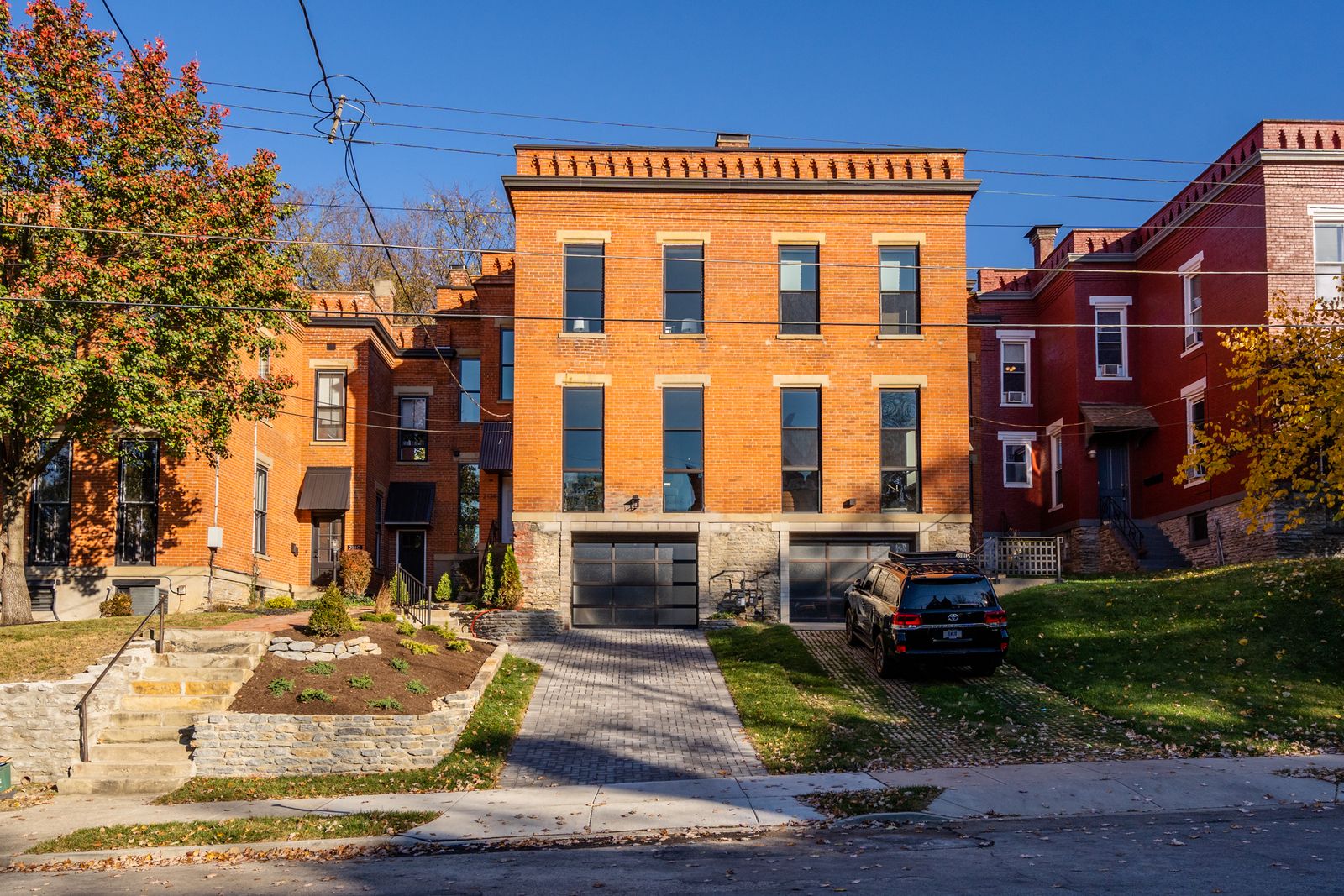Restored historic Italianate brick home viewed from the street
