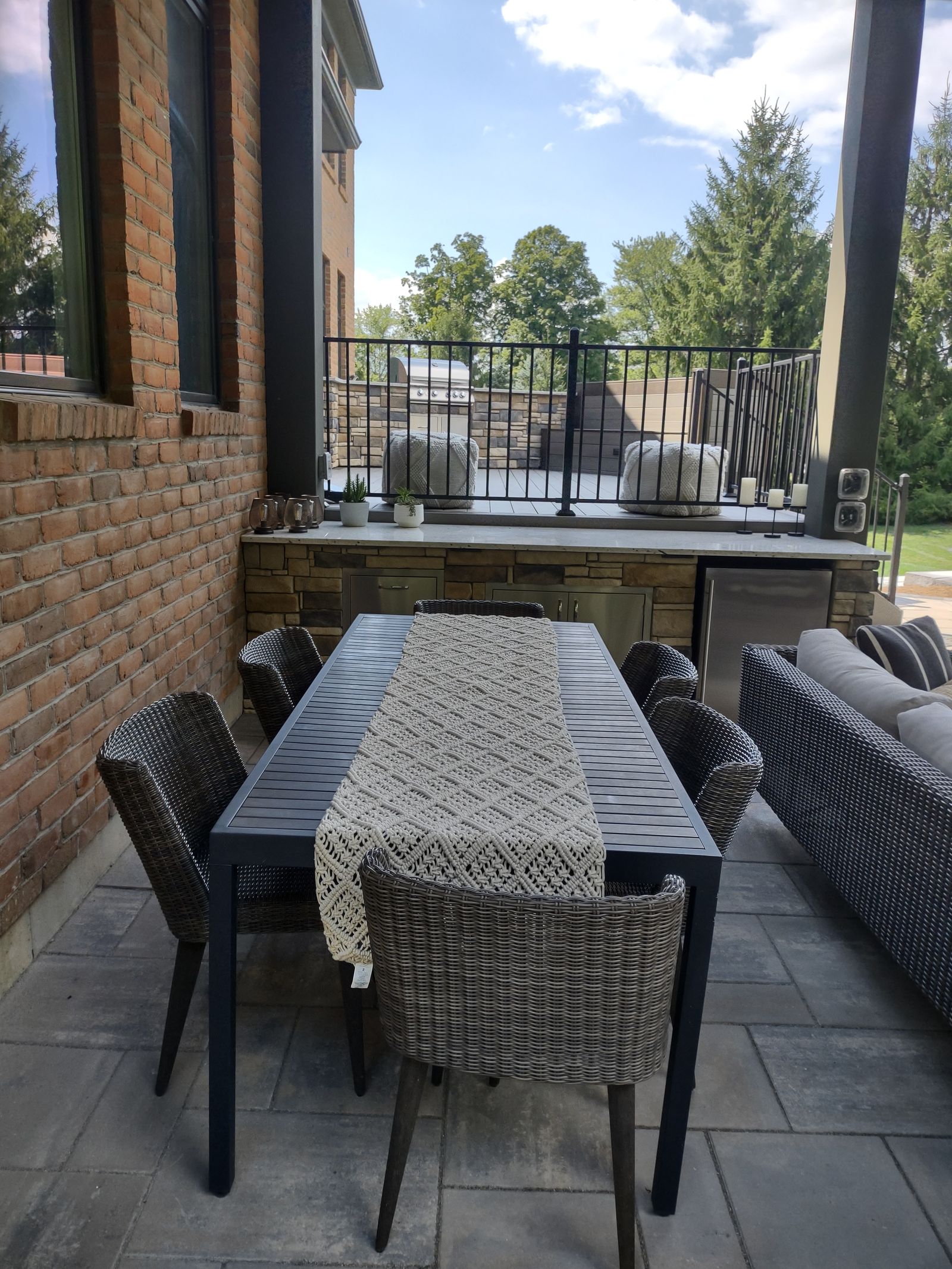 Multi-level timber deck with a stone outdoor fireplace