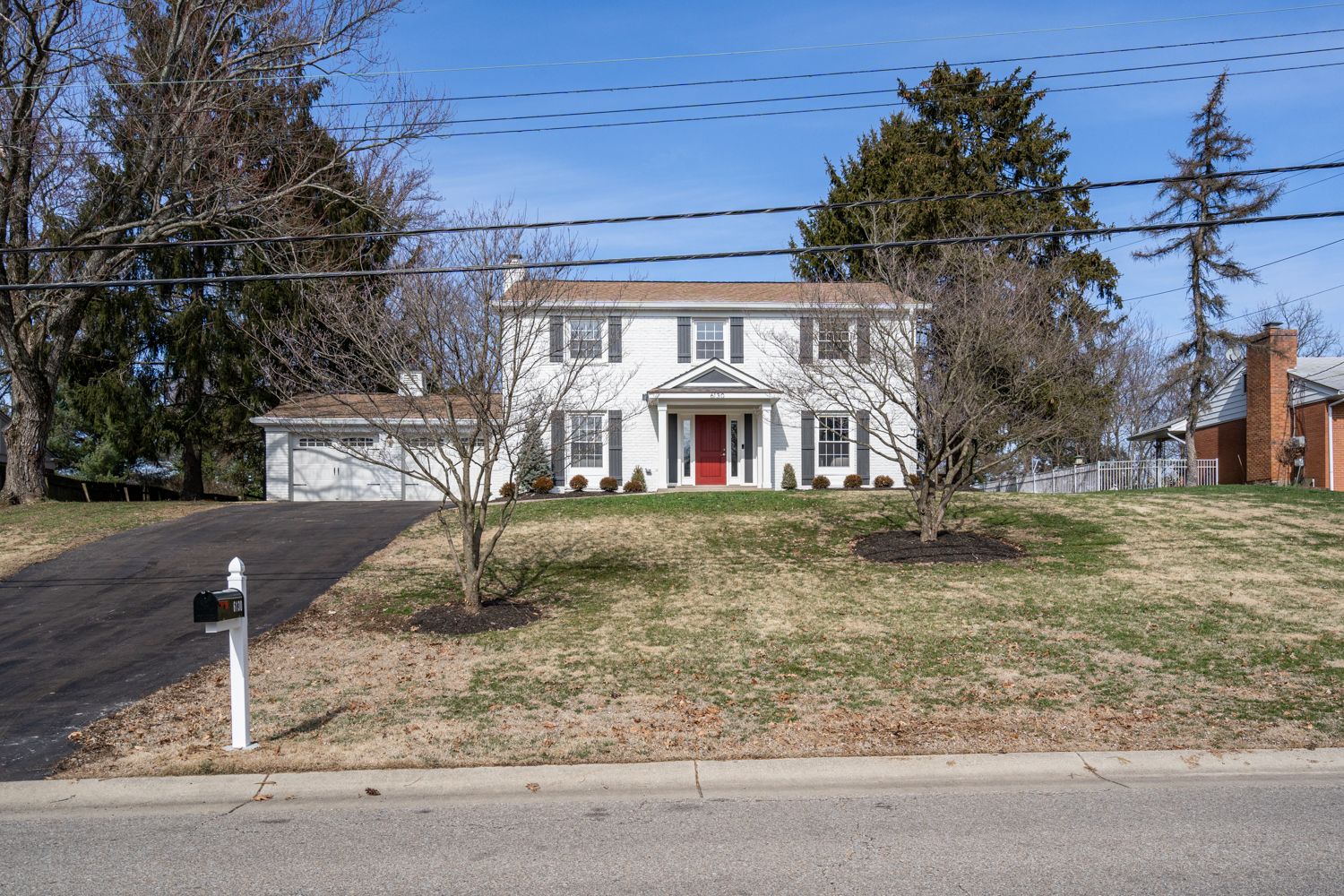 Front elevation after white-painted brick and new entry portico